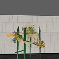 Modern Bamboo Decorative Structure With Yellow Flowers Green Plants Against Gray Wall