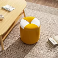 Yellow and White Round Leather Ottoman in Living Room with Coffee Table and Books