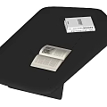 Black Leather Coffee Table With Stitched Surface And Open Closed Books
