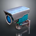 Silver Metallic Security Camera With Blue Lens And Mounting Bracket