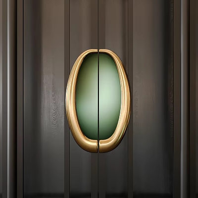 Elegant Gold Oval Door Handle with Green Center on Dark Wooden Door 3d model