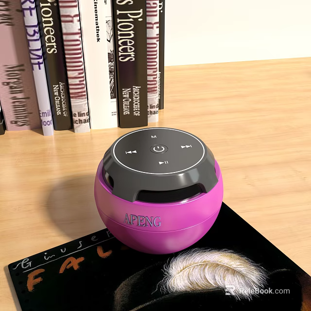 Pink Round APENG Bluetooth Speaker on Wooden Tabletop with Books and Magazine 3d model 
