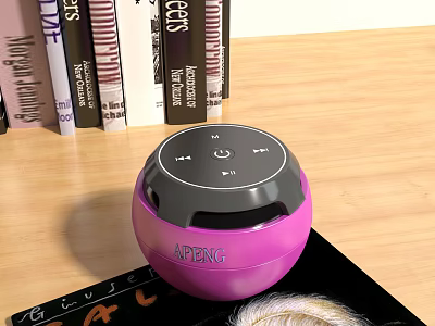 Pink Round APENG Bluetooth Speaker on Wooden Tabletop with Books and Magazine 3d model