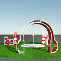 Red Headphone Shaped Event Entrance Arch For Vannele Festival With Decorations On Grass Field