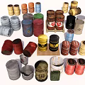 Various Colored Metal and Wooden Barrels with Warning Signs Stacked and Placed