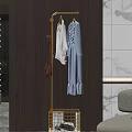 Golden Coat Rack With White And Light Blue Clothes And Pink Bag In Modern Interior