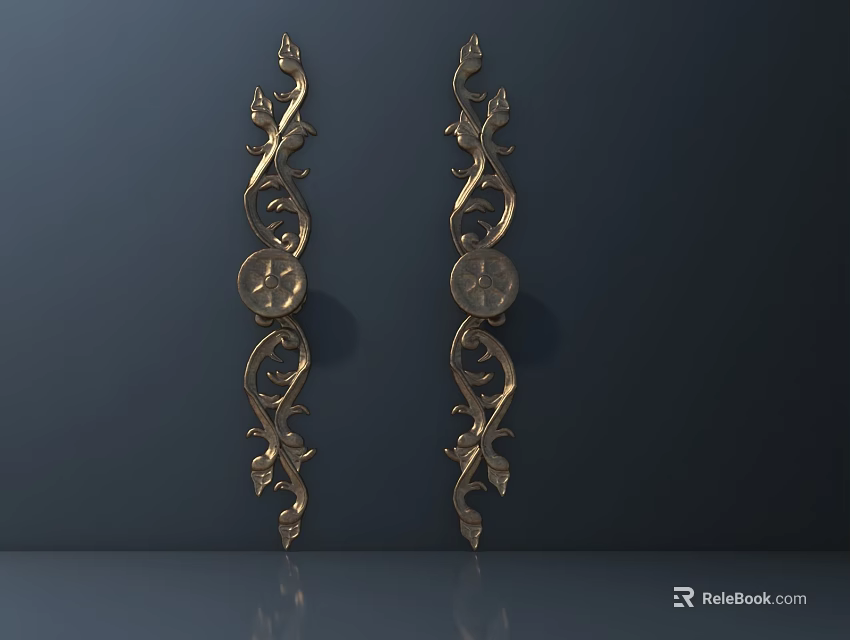 Two Golden Decorative Hardware Tools Featuring Floral Patterns And Circular Details 3d model