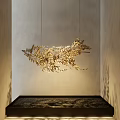 Elegant Golden Fern Leaf Shaped Hanging Pendant With Light Shadow On Interior Wall