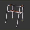 White Frame Mobility Walker With Orange Handles Seat And Green Foot Pads