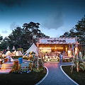 Aerial View of Illuminated Campsite With Multiple Tents RVs And Outdoor Gathering Areas