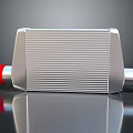 Silver Radiator With Red Connectors And Fins On Smooth Reflective Surface