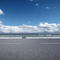 Highway Fence Along Road With Blue Sky White Clouds And Green Grassland