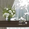 Transparent Glass Vase With White Roses And Green Leaves On Wooden Table