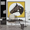 Stylish Desk with Books and Chair in Interior with Yellow Horse Painting and Green Plant