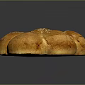 Freshly Baked Golden Round Shaped Bread with Sesame Seeds on Top