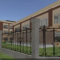 Red Brick School Buildings With Football Field Running Track And Trees In Clear Blue Sky