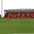 Football Stadium With Red Stands WFC Letters Green Pitch And Floodlight