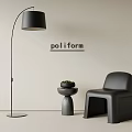 Black Leather Leisure Chair with Small Side Table Potted Plant and Floor Lamp