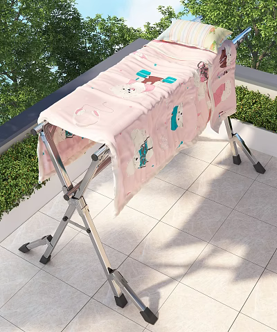 Metal Folding Clothes Rack With Pink Cartoon Pattern Cloth For Outdoor Use 3d model
