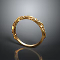 Elegant Gold Fashion Ring With Intricate Decorative Patterns And Shiny Finish