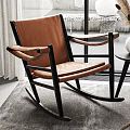 Modern Brown Leather Rocking Chair With Wooden Frame And Side Table Vase Pampas Grass Interior