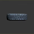 3D Rendered Tire With Blue Tread Pattern And Orange Rim Design