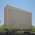 Modern Office Building With White Exterior Glass Windows And Trees Along Road With Cars