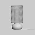 Modern White Table Lamp With Circular Perforated Shade And Warm Glow