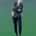 A Woman Standing With Arms Crossed In Leather Jacket And Dark Pants Against Light Green Background