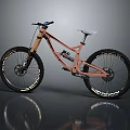 Peach Frame Downhill Mountain Bike With White Seat Large Tires And Suspension On Reflective Surface