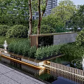 Lush Modern Residential Landscape With Greenery Water Fountains And Wooden Fence