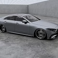 Silver Mercedes Sleek Sedan With Alloy Wheels In Modern Indoor Concrete Space