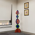 Modern Colorful Circular Stacked Sculpture in Living Room with Fireplace and Wall Art
