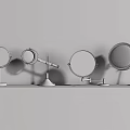 Round Vanity Mirrors With Metal Stands On Wooden Countertop Against Dark Wall