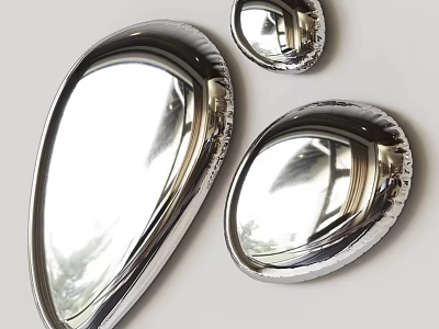 Three Shiny Metallic Shell Shaped Objects With Polished Reflective Surface On White Background 3d model