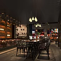 Modern Bar Interior With Wooden Wine Shelves Hanging Pendant Lights And Dining Tables