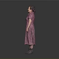 Woman in Pink Floral Dress with Neatly Styled Hair and Gray Shoes Against Gray Background