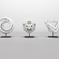 Modern White Geometric Sculptures with Intricate Hollow Patterns on Black Stands