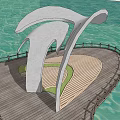 Waterfront Landscape With Large White Curved Sculpture Wooden Boardwalk Railing Grass Area People Cycling Walking