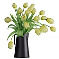 Beautiful Yellow Tulips In Black Pitcher Vase With Fresh Green Leaves