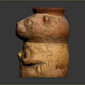 Terracotta Ceramic Vessel With Animal Head Skull Carvings And Red Brown Beige Textured Surface