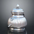 Ornate Carved Silver Lidded Container With Decorative Patterns And Spire Top