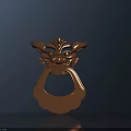Copper Colored Door Handle with Animal Head Shape Horns and Facial Details on Dark Background
