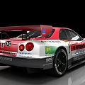 Red Nissan Racing Car With Sponsor Logos And Number 2 Design