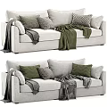 Cozy Three Seater Sofa With Patterned Pillows And Soft Blankets