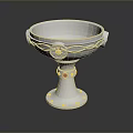 Silver Metal Goblet Shaped Sculpture Carving With Intricate Decorative Details And Red Gemstones On Base