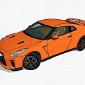 Orange Nissan GT-R Sports Car Parked In Green Grass With Trees Background