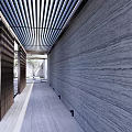 Modern Building Exterior Wall With Black Facade Open Entrance Steps And Paved Ground