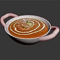 Creamy Red Soup With White Swirls And Green Garnish In White Bowl