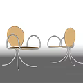 Modern Leisure Chair Featuring Curved Metal Arms Beige Upholstery And Sleek Metal Base Design